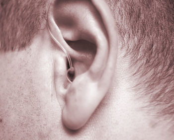 Close-up of man with hearing aid