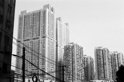 Low angle view of modern buildings against clear sky