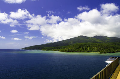 Cruise ship approaching tropical island