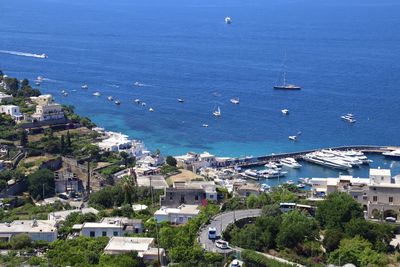 High angle view of townscape by sea