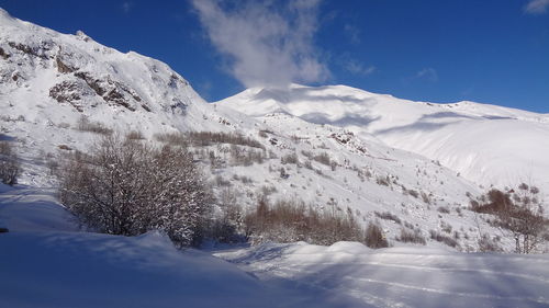 Snow covered mountains against sky