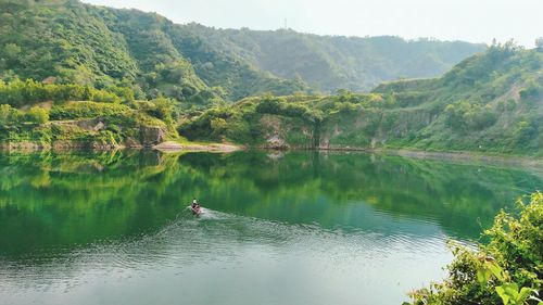 Scenic view of lake by trees