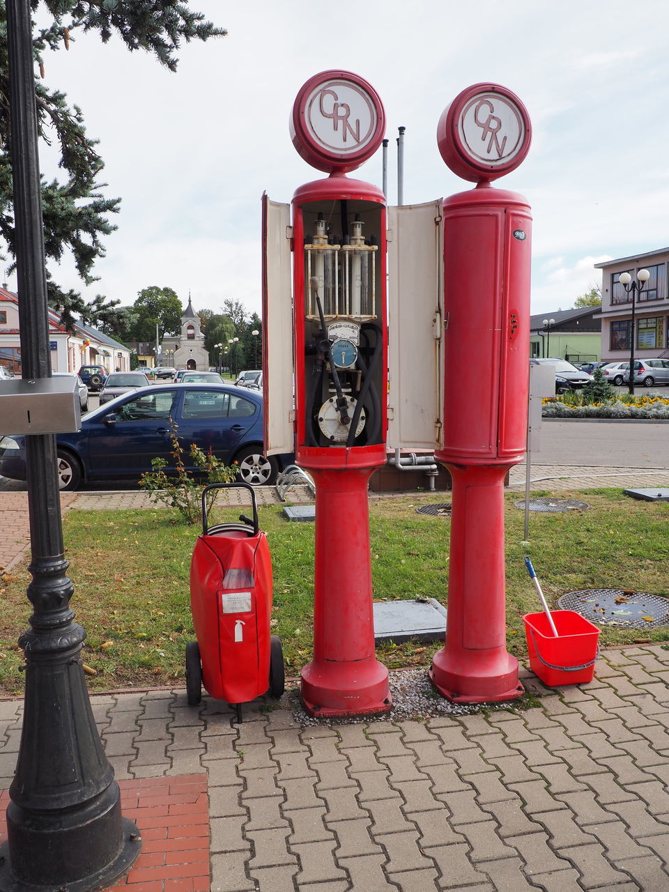 red, day, city, transportation, no people, safety, nature, street, mode of transportation, fire hydrant, outdoors, accidents and disasters, architecture, metal, sky, security, plant, protection, built structure, footpath