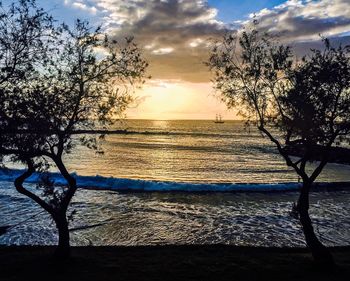 Scenic view of sea against cloudy sky