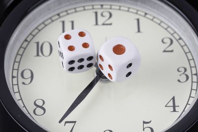 High angle view of clock on paper