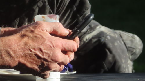 Cropped hand of man holding hands