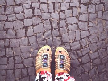 Low section of person standing on footpath