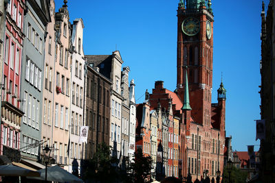 Low angle view of buildings against blue sky