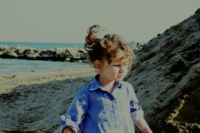 Girl standing at beach