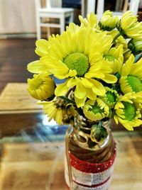 Close-up of yellow flowers on table