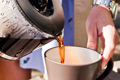 Close-up of man preparing food in kitchen