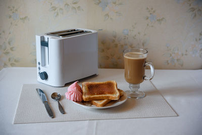 Coffee cup on the table. breakfast. the toaster.