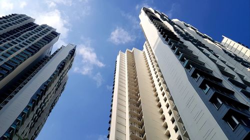 Low angle view of modern buildings against sky