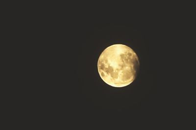 Low angle view of moon against sky at night