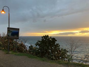 Scenic view of beach against sky during sunset