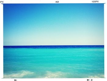 Scenic view of calm sea against clear sky