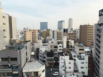 High angle view of buildings in city against sky