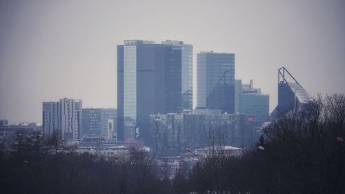 Buildings in city against sky