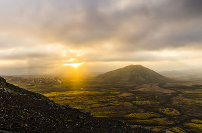 Scenic view of landscape against sky during sunset