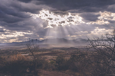 Scenic view of landscape against cloudy sky