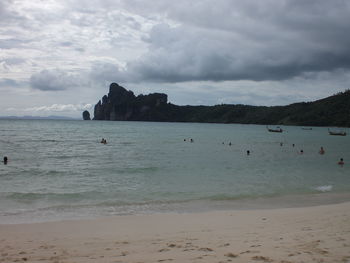 Scenic view of sea against cloudy sky