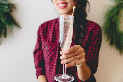 Midsection of woman holding drink