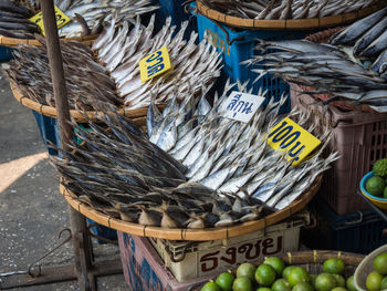 Dried fish for sale in baskets on maha chai fish market, thailand