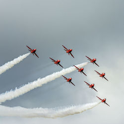 Low angle view of airshow in sky