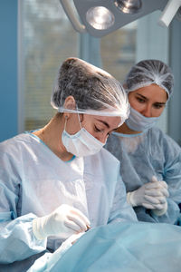 Female doctor examining patient at clinic