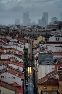 High angle view of buildings in city against sky