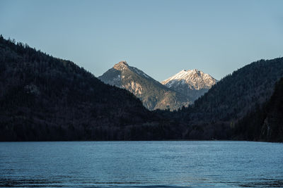 Scenic view of snowcapped mountains against clear sky