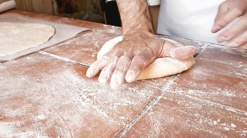 Midsection of man preparing food