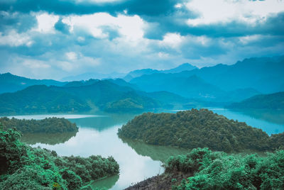 Panoramic view of river and mountains against sky