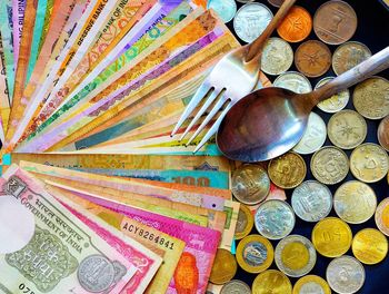 High angle view of coins on table