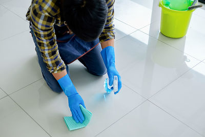 Woman cleaning floor at home