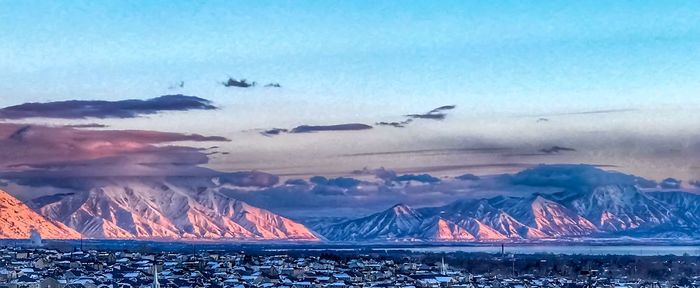 Scenic view of lake against sky during winter