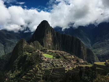 High angle view of ruins of mountain against cloudy sky