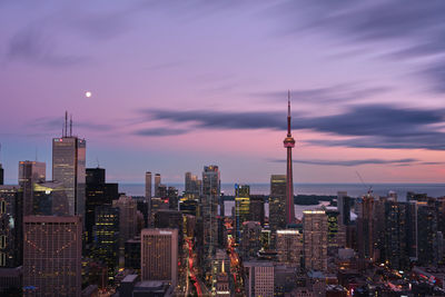 Modern buildings in city at sunset