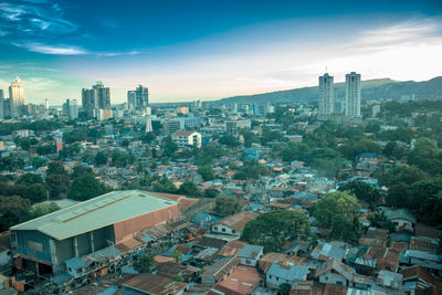 High angle view of buildings in city against sky