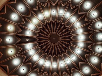 Low angle view of illuminated ceiling