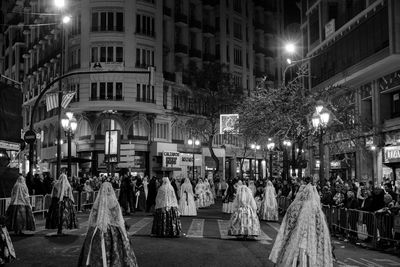 Group of people in front of building at night