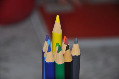 Close-up of multi colored pencils on table