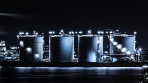 Illuminated lights against sky at night