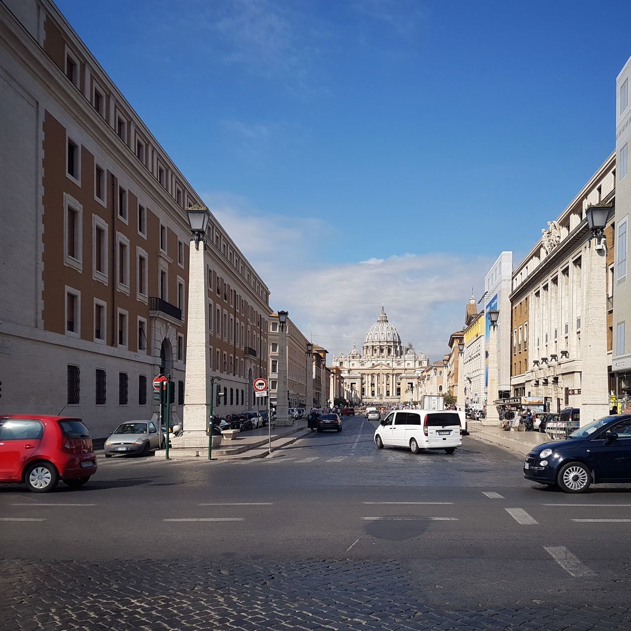 CARS ON STREET IN CITY