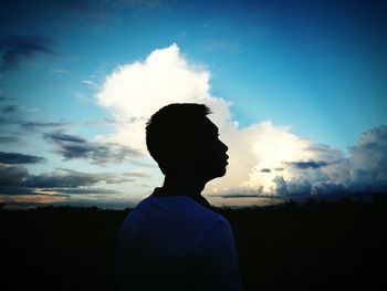 Portrait of silhouette man standing against sky during sunset