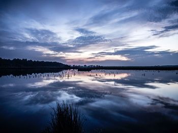 Reflection of clouds in calm lake