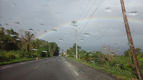 View of road against cloudy sky