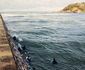 High angle view of people on beach against sky