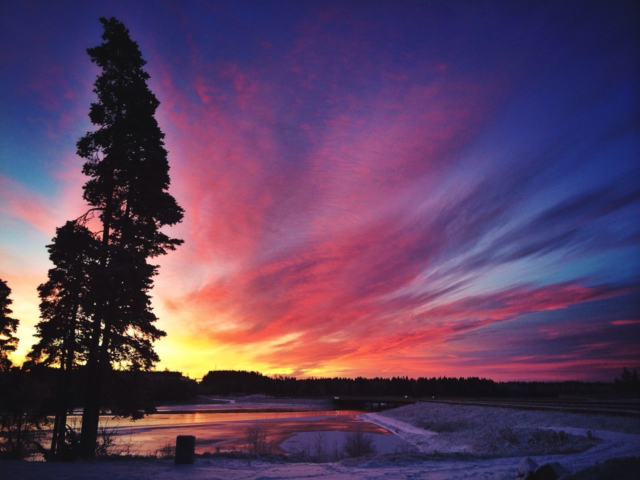 sunset, tranquil scene, scenics, tranquility, beauty in nature, sky, snow, winter, cold temperature, tree, orange color, nature, landscape, silhouette, idyllic, cloud - sky, season, weather, field, dramatic sky