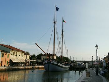 Boats moored at harbor